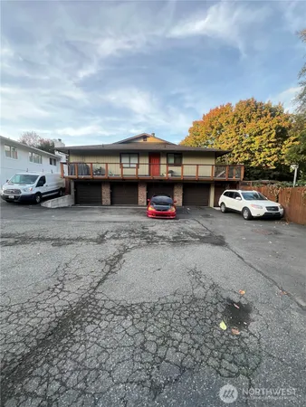 a view of a cars park in front of house