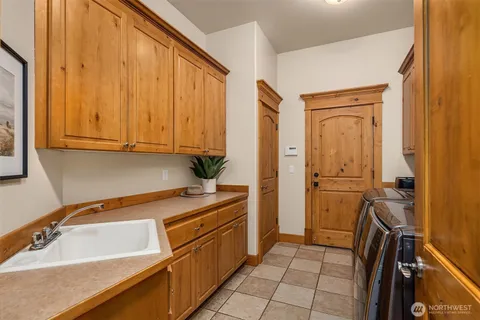 a room with a sink and cabinets