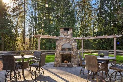 an outdoor space with furniture and fireplace
