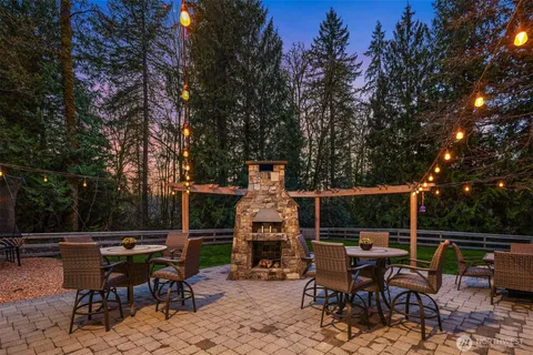 a view of backyard with sitting area