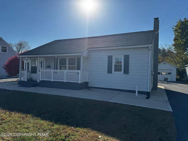 a house view with a garden space