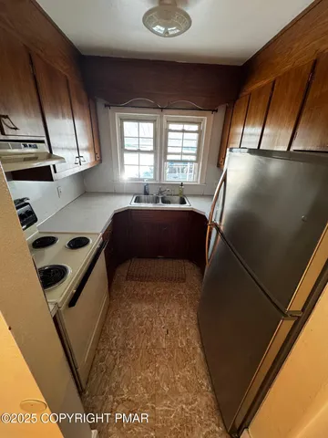 a view of kitchen with furniture and window