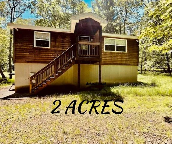 a view of a house with a wooden door
