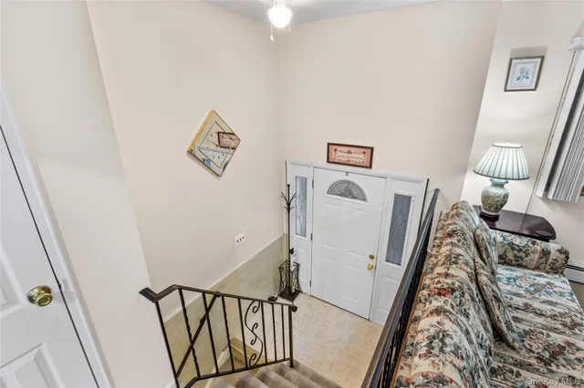 a view of a hallway with furniture