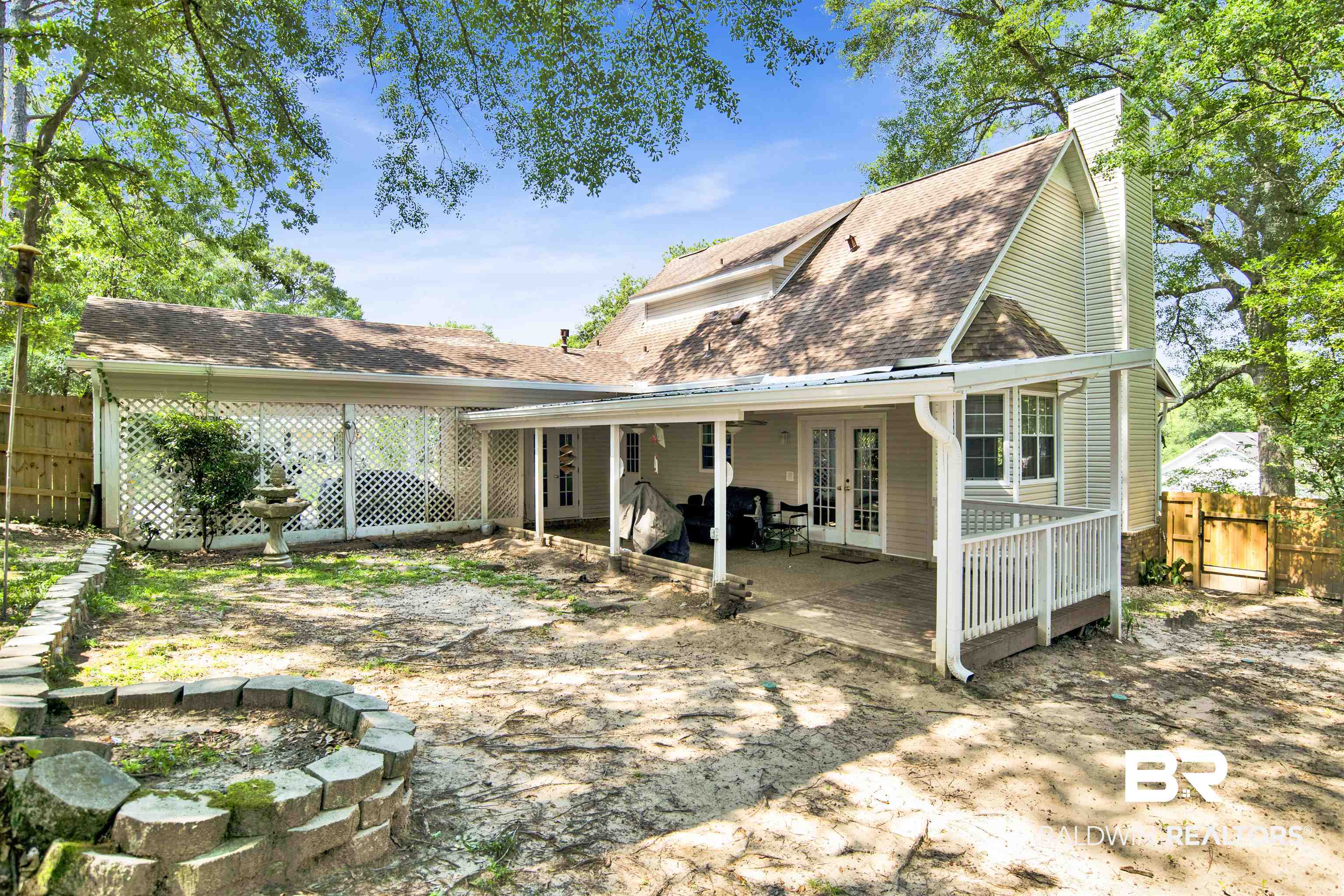 3412 Peyton Court Mobile, AL 36695 - Photo 27 of 27 Back of house with french doors, a fenced backyard, a chimney, and roof with shingles