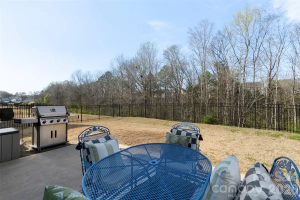 a view of a backyard with furniture