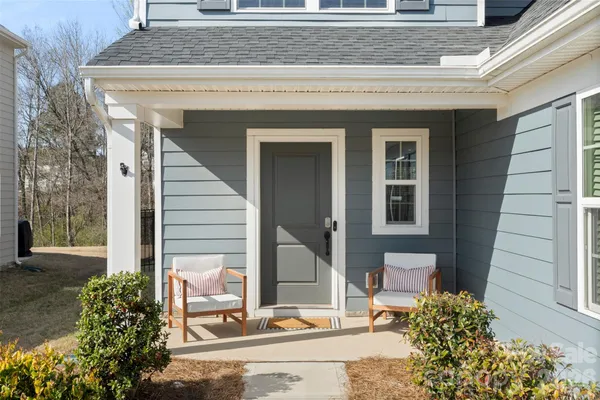a front view of a house with a porch