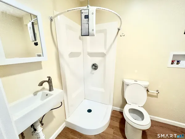 a bathroom with a toilet and a sink