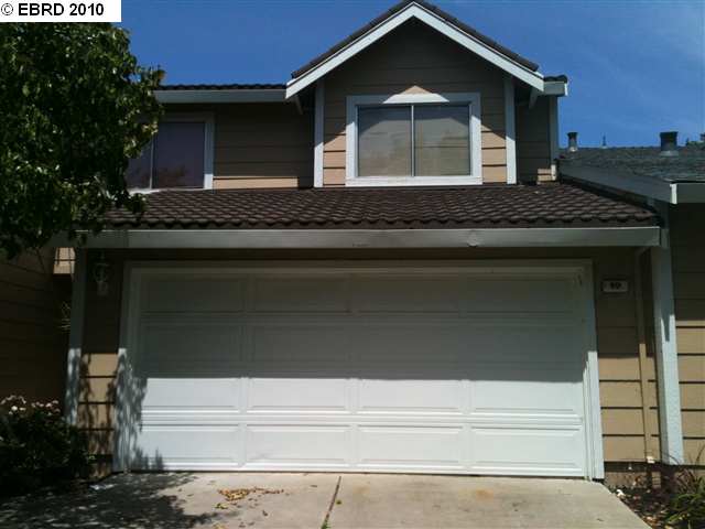 a front view of a house with garage