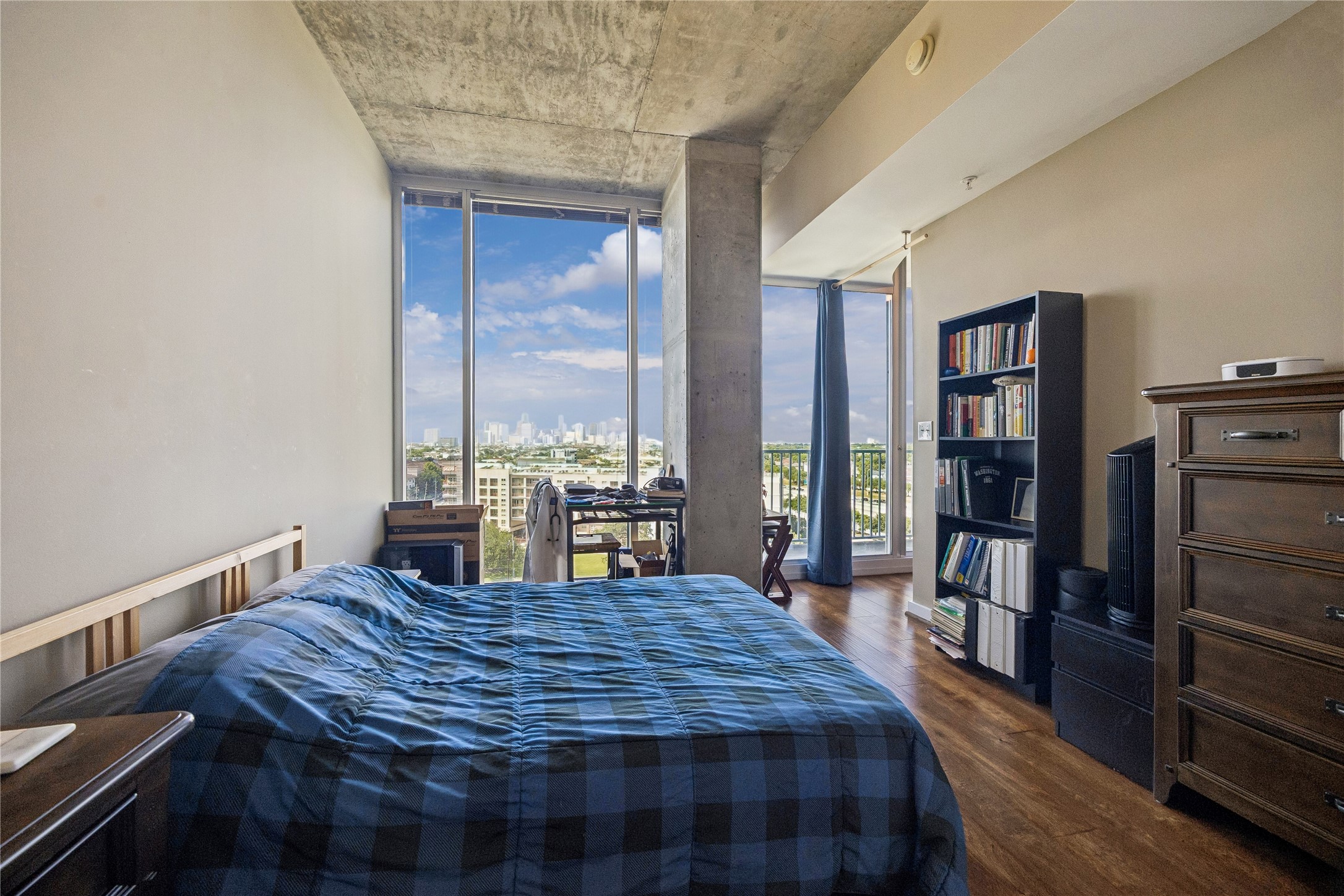 5925 Almeda Road, Unit 11011 Houston, TX 77004 - Photo 13 of 24 The bedroom accommodates a queen-sized bed and various storage pieces. Enjoy the morning view and evening city lights.