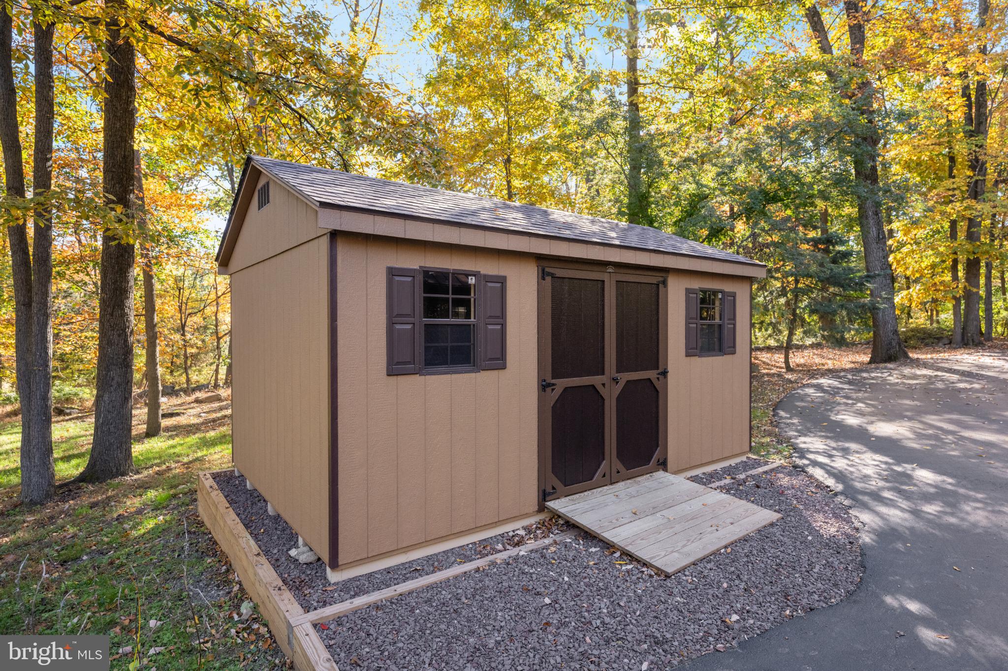 1623 Hilltop Road Spring City, PA 19475 - Photo 20 of 70 Charming shed nestled in vibrant autumn woods.