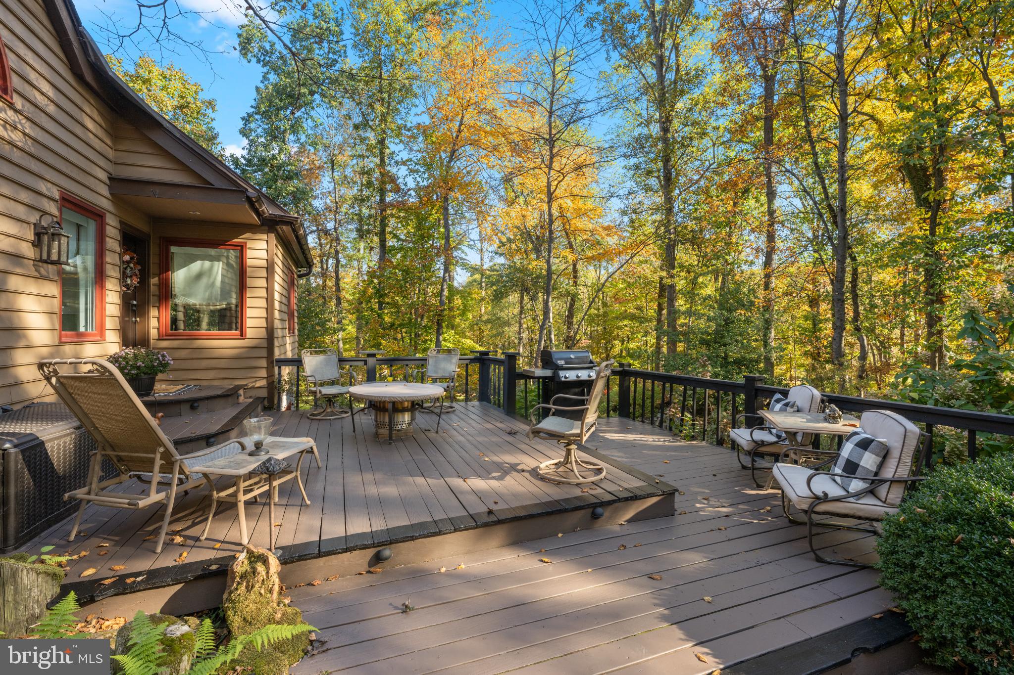 1623 Hilltop Road Spring City, PA 19475 - Photo 4 of 70 Serene deck surrounded by vibrant autumn trees.
