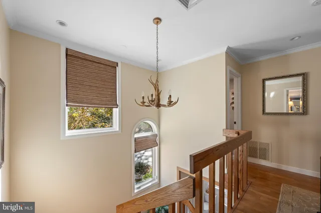 a bed room with a bed and a large window