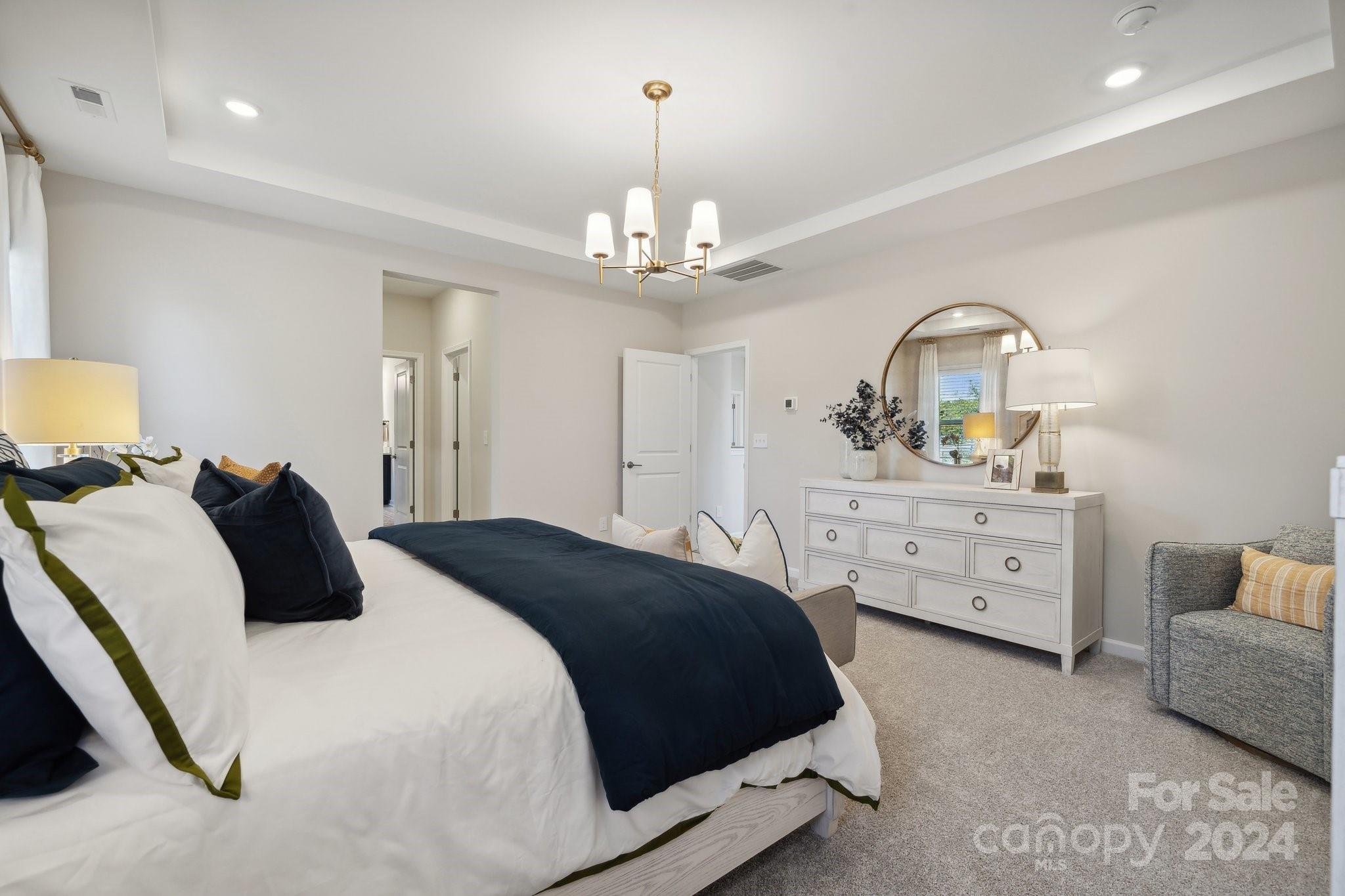 1414 Hubert Graham Way Tega Cay, SC 29708 - Photo 20 of 28 a bedroom with a bed and a dresser