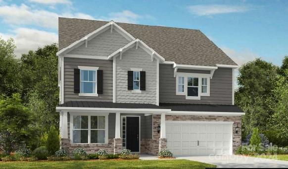 1414 Hubert Graham Way Tega Cay, SC 29708 - Photo 2 of 28 a front view of a house with yard and garage