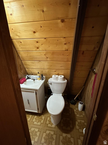 1456 Navajo Road Coalville, UT 84017 - Photo 35 of 55 Bathroom with wood walls, vanity, and wooden ceiling