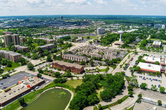 an aerial view of residential houses with outdoor space