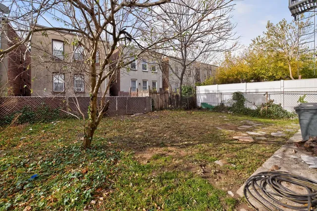 a view of a backyard of the house