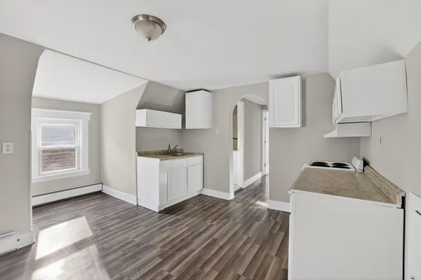 a kitchen with stainless steel appliances a refrigerator sink and cabinets