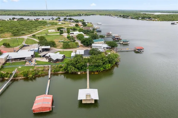 an aerial view of a house with a lake view