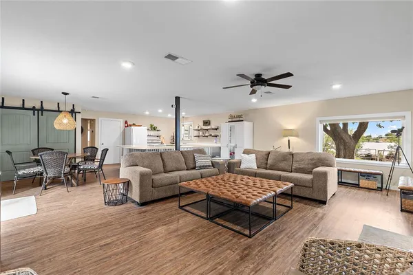 a living room with furniture rug and window