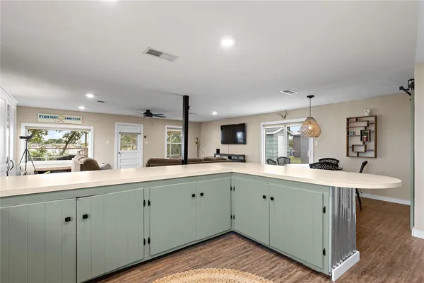 a kitchen with a sink and cabinets
