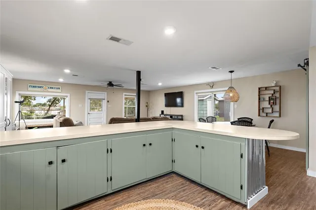 a kitchen with a sink and cabinets