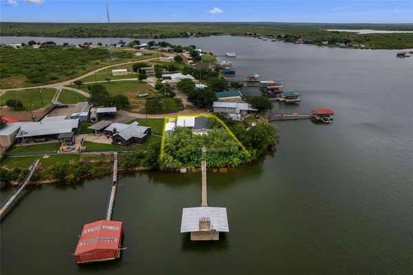 an aerial view of a house with a lake view