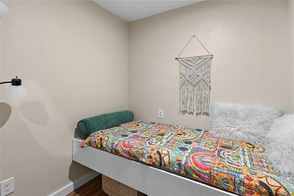 a bedroom with a bed and a table in it