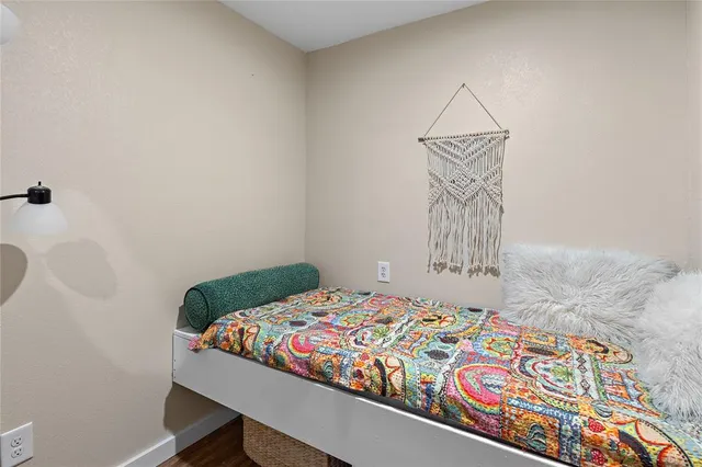 a bedroom with a bed and a table in it