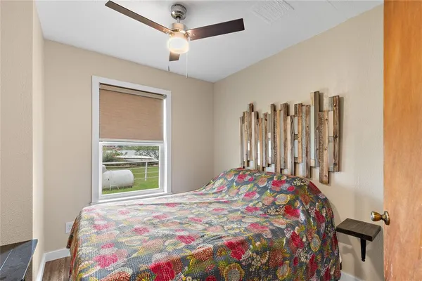 a bedroom with bed and a window