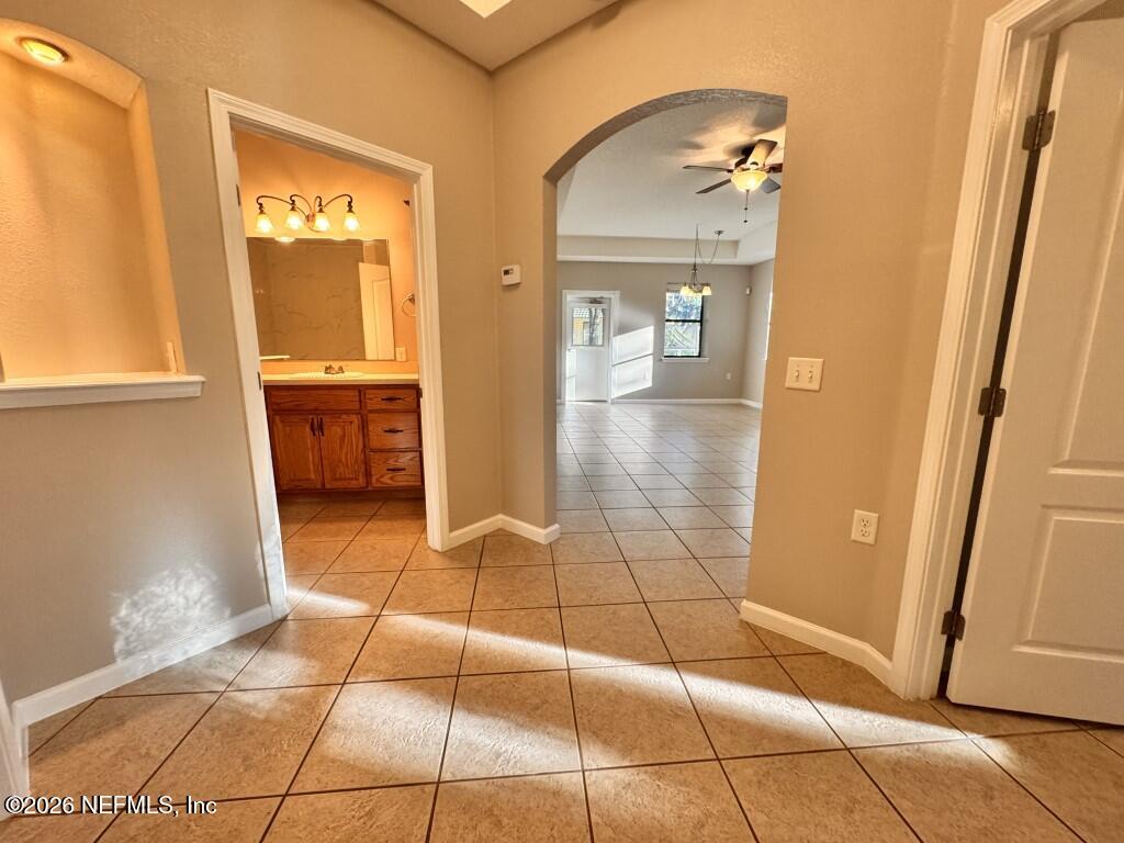 1467 Rivers Road Green Cove Springs, FL 32043 - Photo 15 of 22 a view of a bathroom with sink and mirror