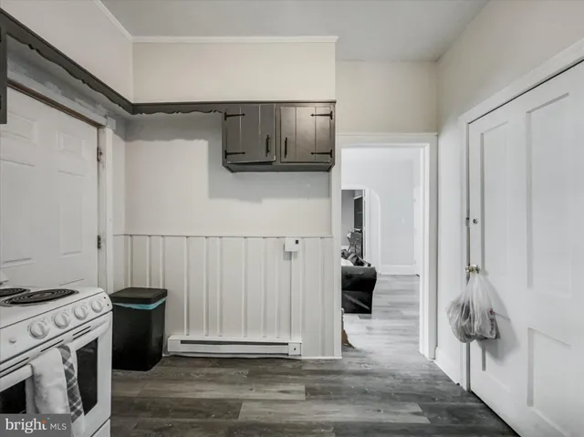 a kitchen with a stove and a refrigerator