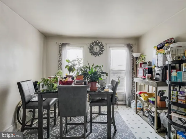 a view of a dining room with furniture and toys