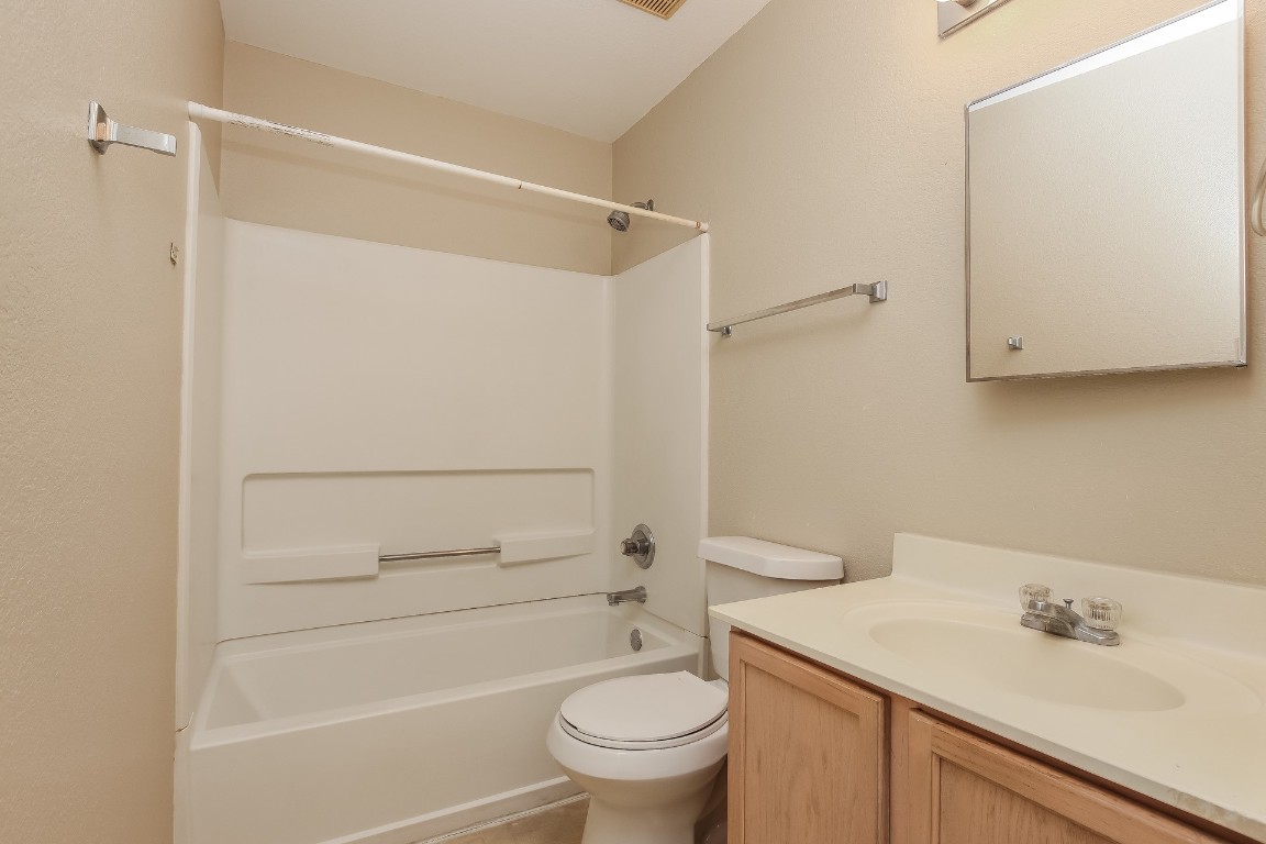 4311 Cisco Valley Drive Round Rock, TX 78664 - Photo 13 of 18 a bathroom with a sink a toilet and shower