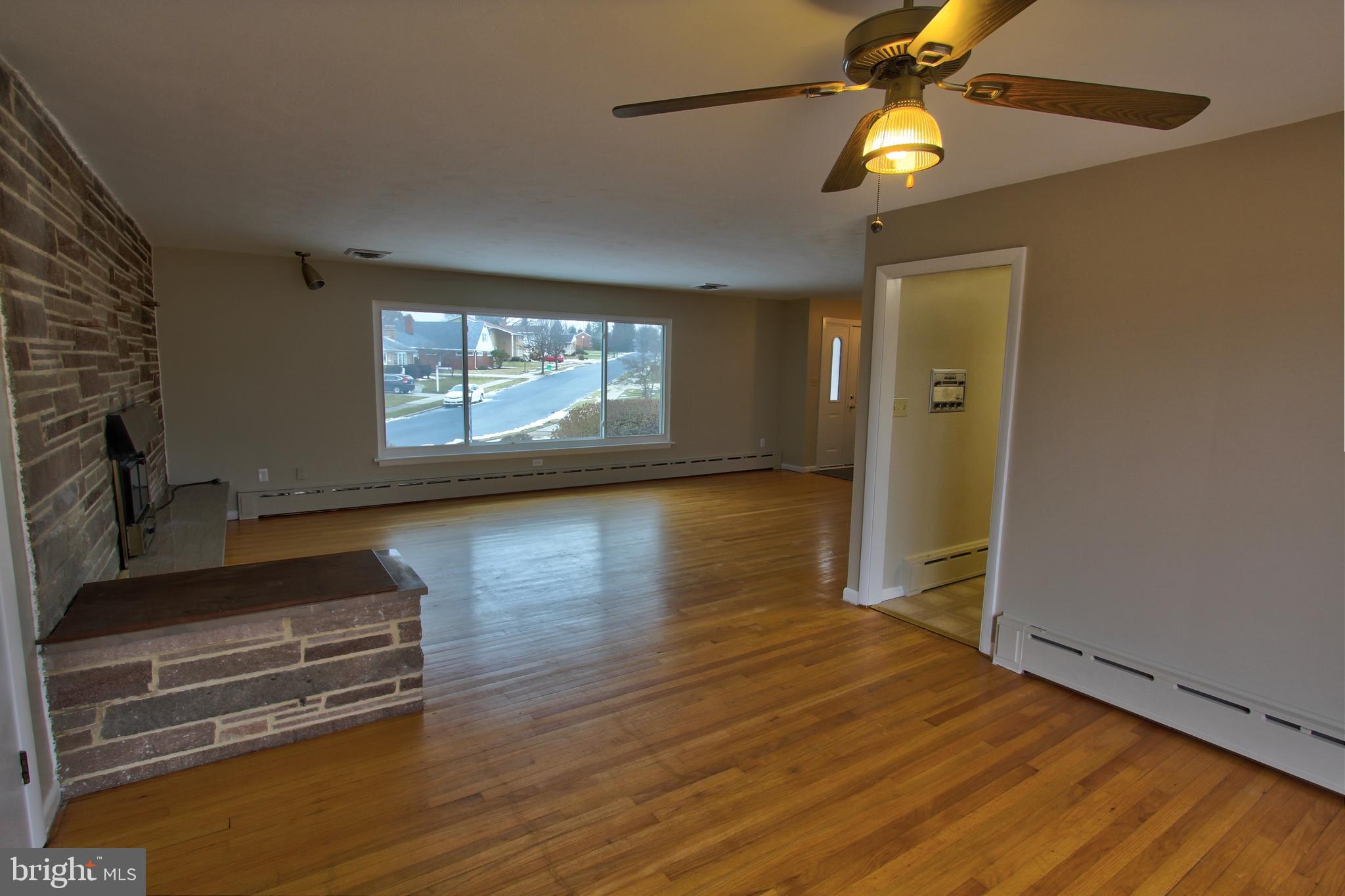 431 Berryhill Road Harrisburg, PA 17109 - Photo 8 of 25 Carpet Tiles Just Pulled up to Expose Wood Floors