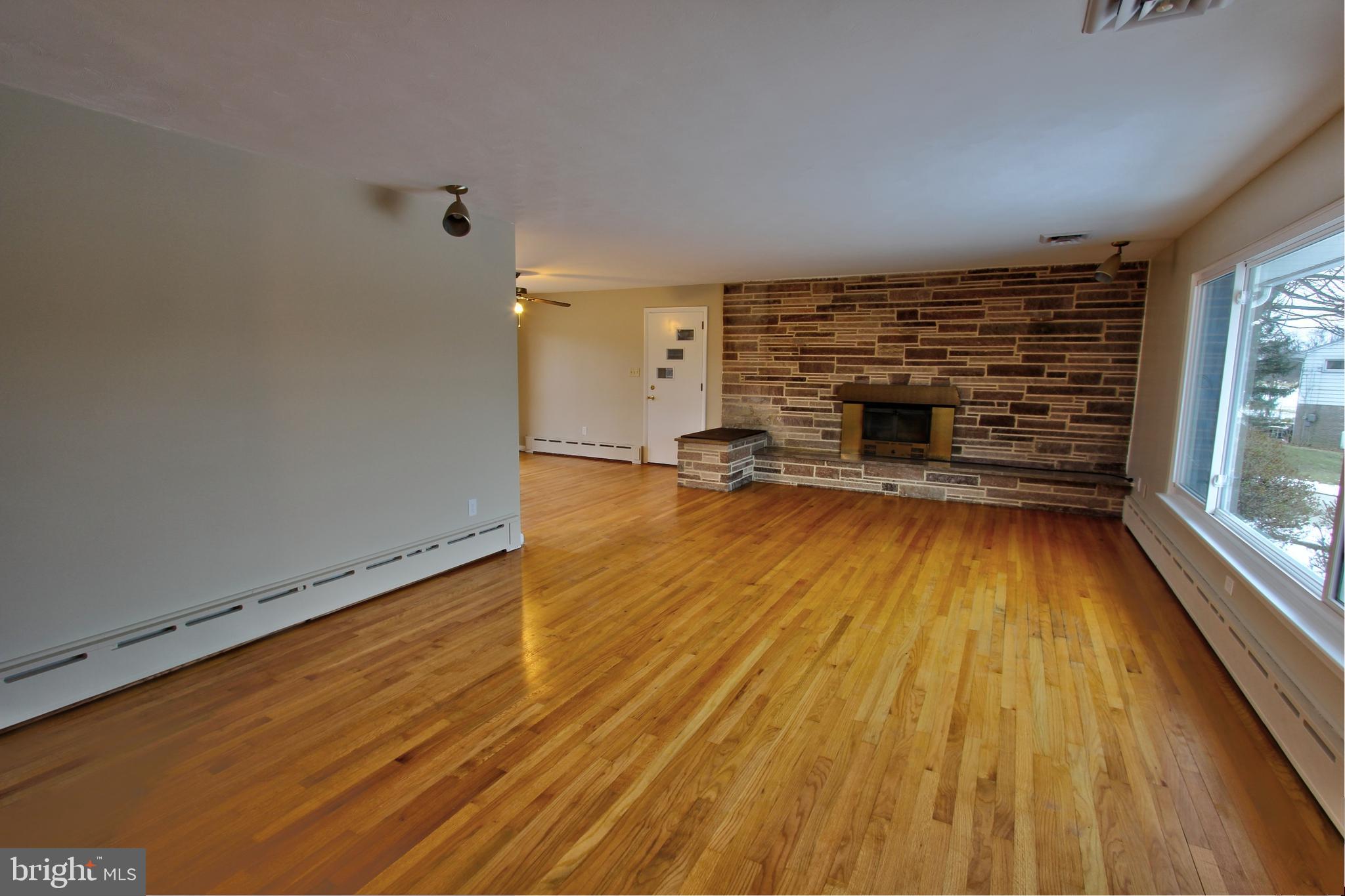 431 Berryhill Road Harrisburg, PA 17109 - Photo 9 of 25 Main Floor Living Room w/ Wood Fireplace