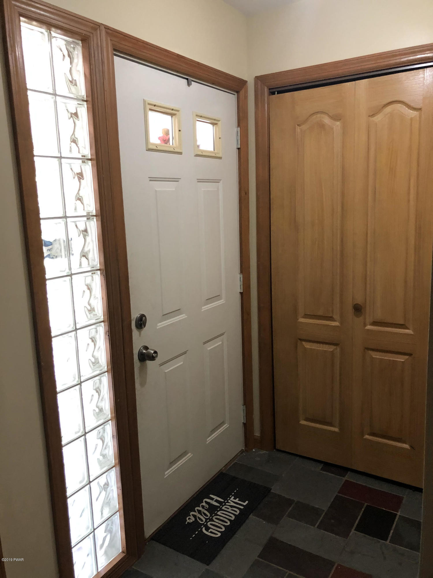 110 Weasel Road Dingmans Ferry, PA 18328 - Photo 21 of 39 a view of entryway with window and bathroom