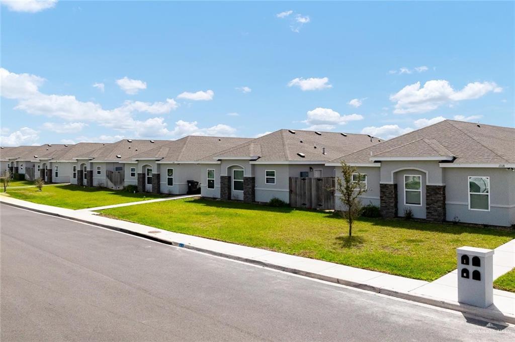 1904 Davenport Street, Unit 4 Weslaco, TX 78596 - Photo 3 of 11 a view of a house with swimming pool and yard