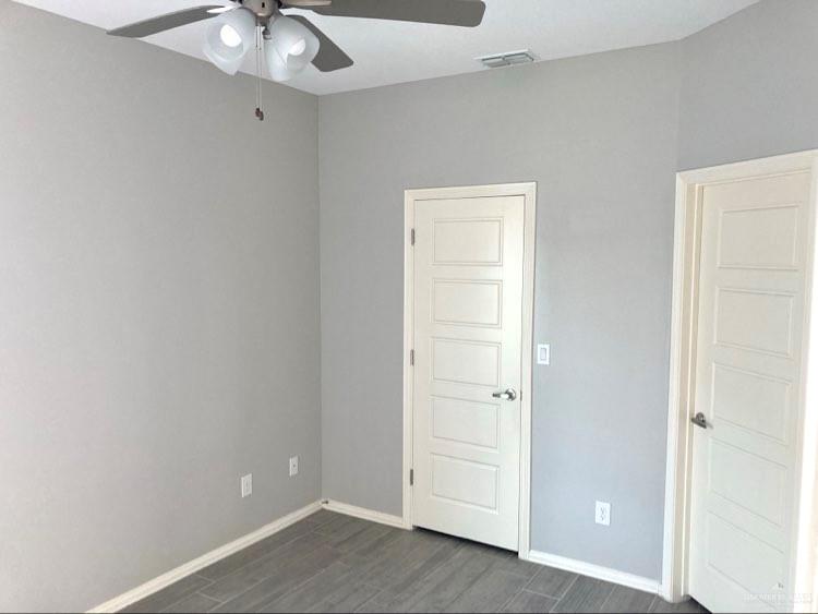 1904 Davenport Street, Unit 4 Weslaco, TX 78596 - Photo 10 of 11 an empty room with chandelier fan