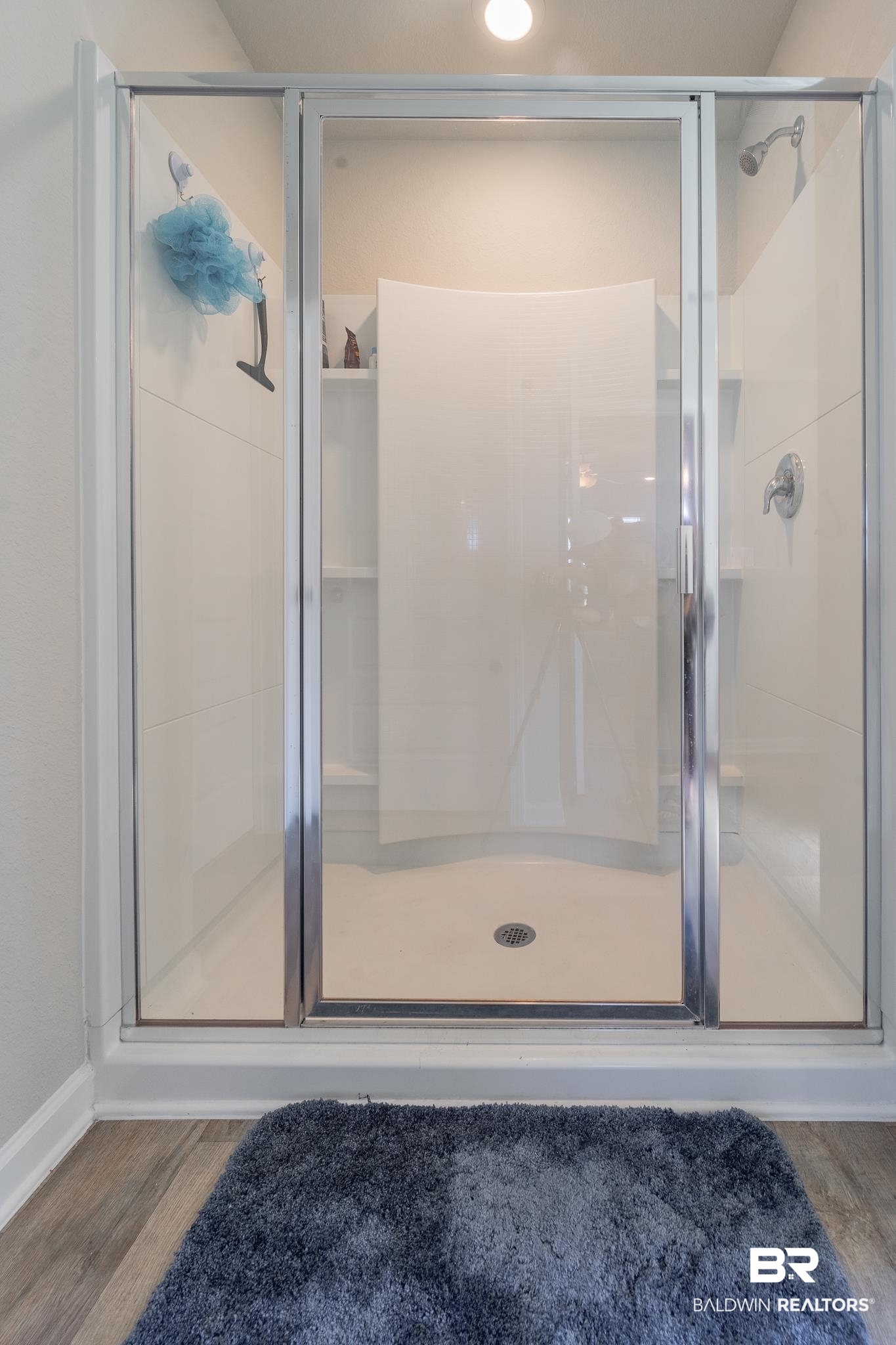 7449 Brompton Drive Foley, AL 36535 - Photo 21 of 27 Bathroom featuring a shower with shower door and hardwood / wood-style flooring