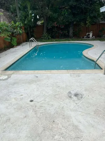 a view of outdoor space with swimming pool
