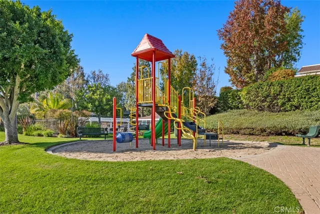 a view of a park with swings and slides