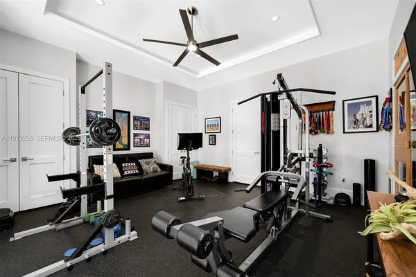 a room with gym equipment and a large window