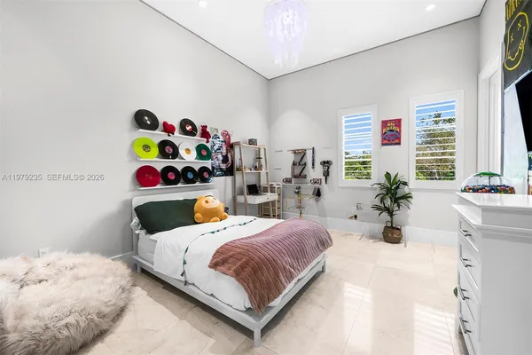 a bedroom with a bed and a desk