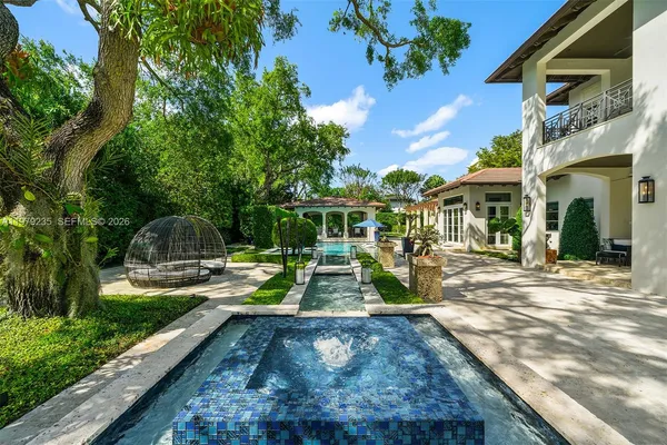 a view of a park with large trees