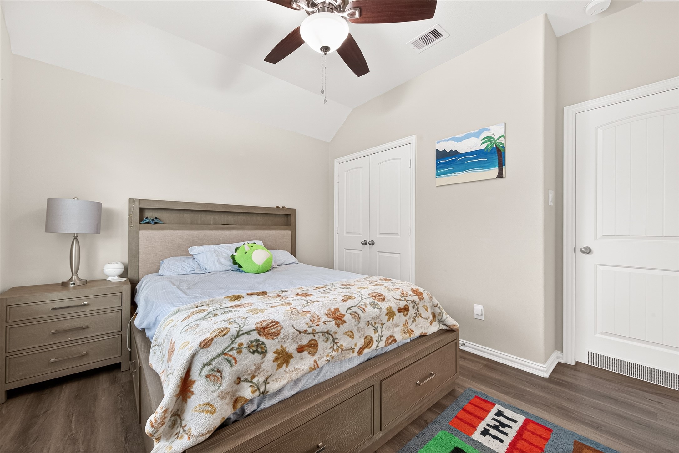 8 Landscape Court Conroe, TX 77301 - Photo 36 of 43 a bedroom with a bed and wooden floor