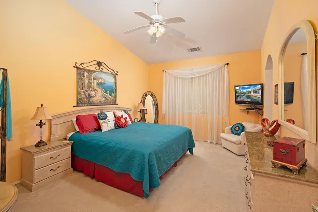 a bedroom with a bed and a dresser