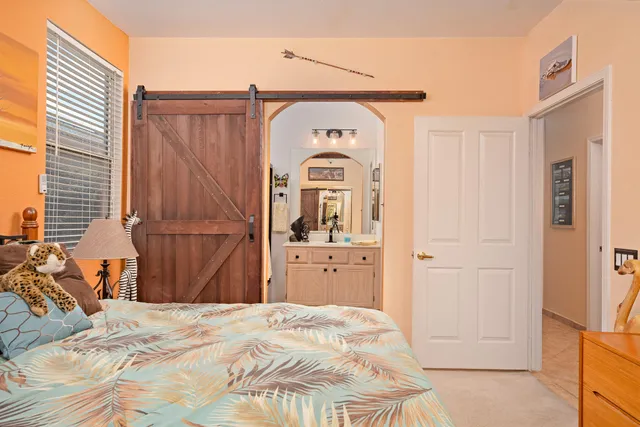 a bedroom with a bed and a dresser