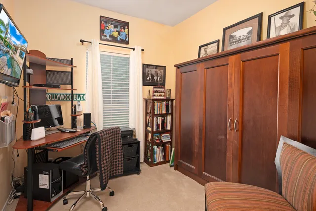 a balcony with furniture and wooden floor